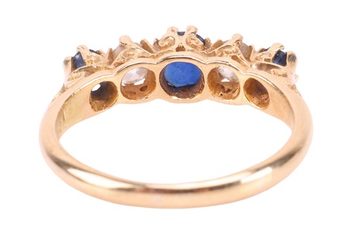 Lot 194 - An Edwardian sapphire and diamond half-hoop...