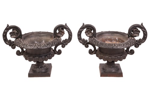 Lot 76 - A pair of decorative heavy cast-handled table...