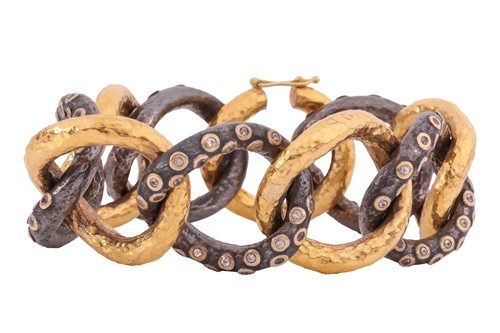 Lot 148 - A 'Milkyway' two-tone link bracelet, by Ara...