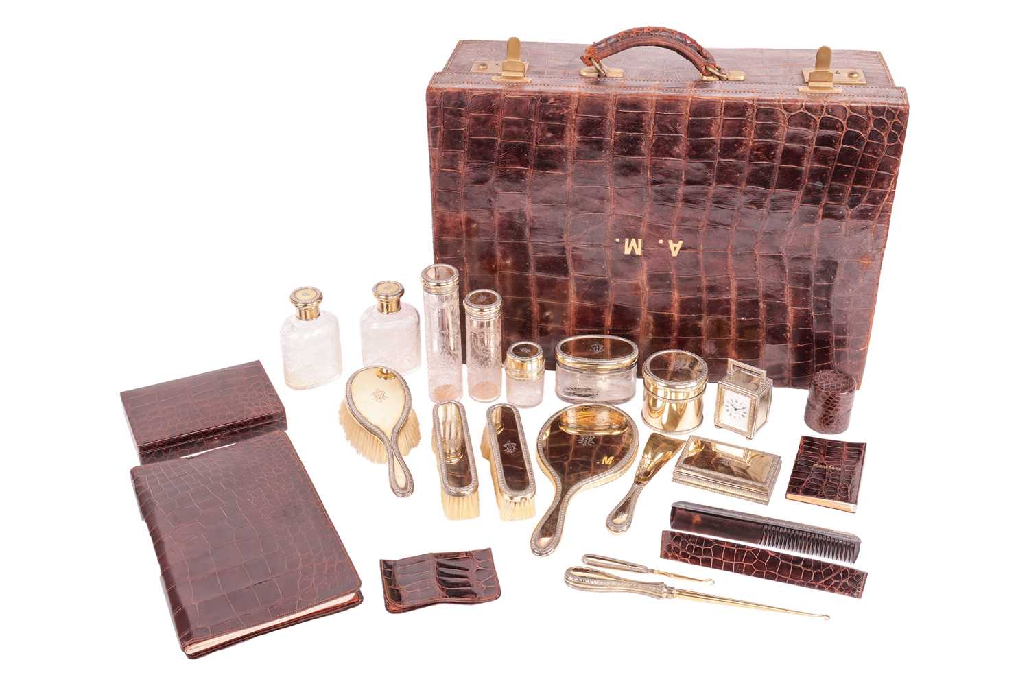 Lot 365 - A fitted crocodile case with silver gilt...