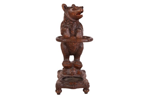 Lot 183 - A carved wood Black Forest stick stand,...