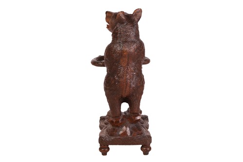 Lot 183 - A carved wood Black Forest stick stand,...