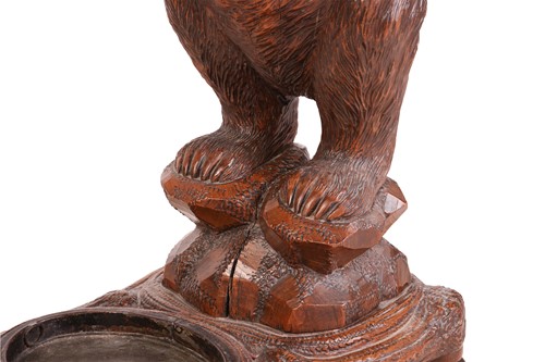 Lot 183 - A carved wood Black Forest stick stand,...