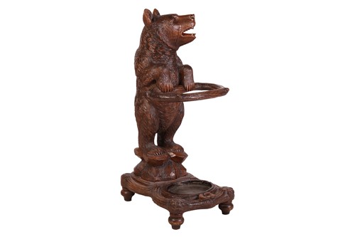 Lot 183 - A carved wood Black Forest stick stand,...