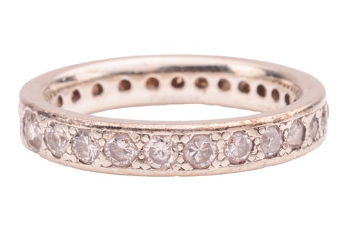 Lot 11 - A diamond-set eternity ring, gypsy-set with...