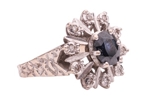 Lot 154 - A sapphire and diamond-set cluster ring, the...