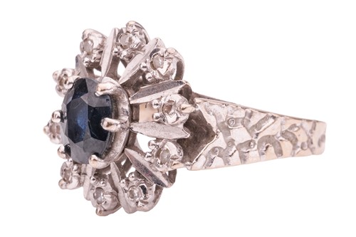 Lot 154 - A sapphire and diamond-set cluster ring, the...