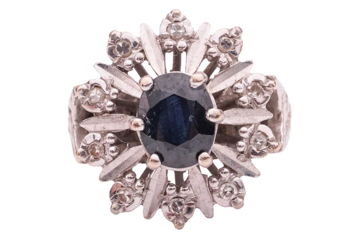 Lot 154 - A sapphire and diamond-set cluster ring, the...