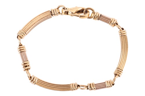 Lot 144 - Boucheron - a two-tone link bracelet in 18ct...