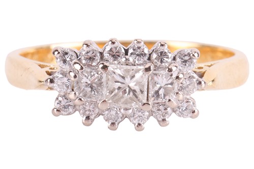 Lot 25 - A diamond-set dress ring, claw-set with three...