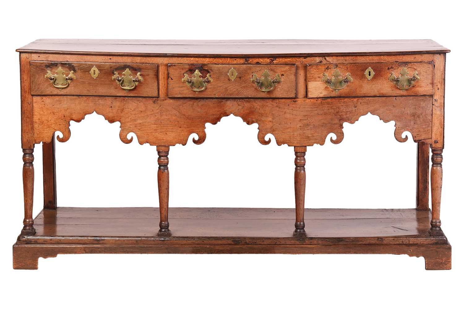 Lot 107 - A George III oak pot board dresser base with a...
