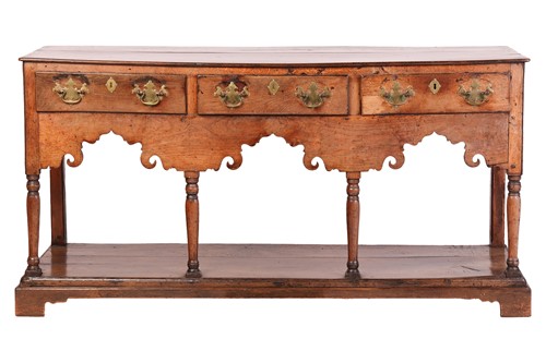 Lot 107 - A George III oak pot board dresser base with a...