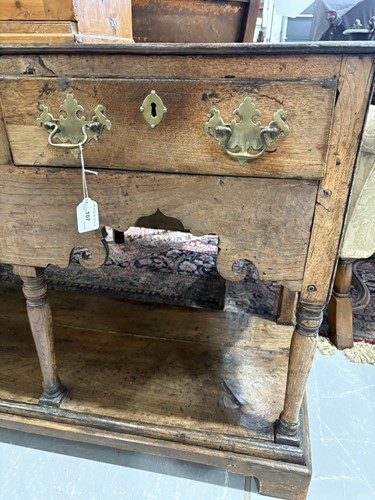 Lot 107 - A George III oak pot board dresser base with a...