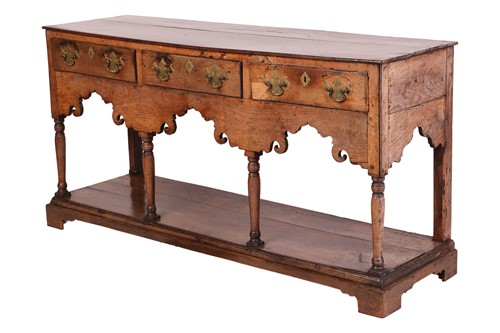 Lot 107 - A George III oak pot board dresser base with a...