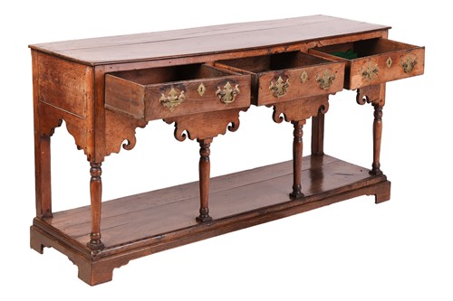 Lot 107 - A George III oak pot board dresser base with a...