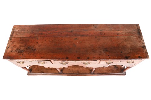 Lot 107 - A George III oak pot board dresser base with a...