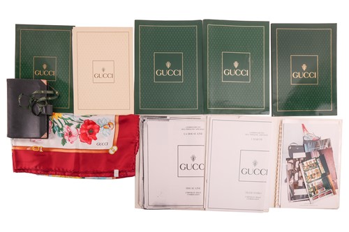 Lot 193 - Gucci: Floral silk scarf and Gucci marketing...