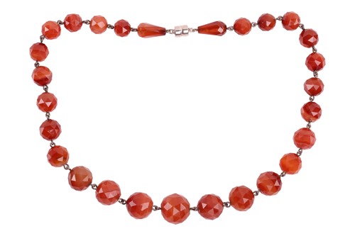 Lot 33 - A carnelian bead necklace, comprising an array...