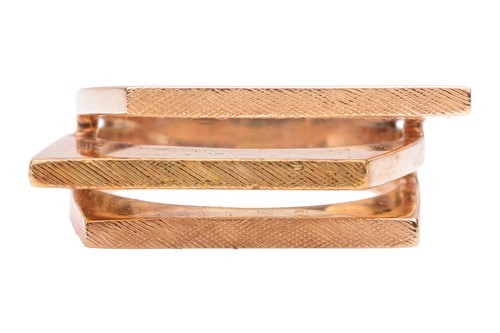 Lot 184 - An abstract dress ring of angular form, flat...