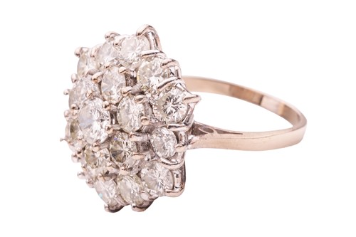 Lot 200 - A diamond-set floral cluster ring, featuring...