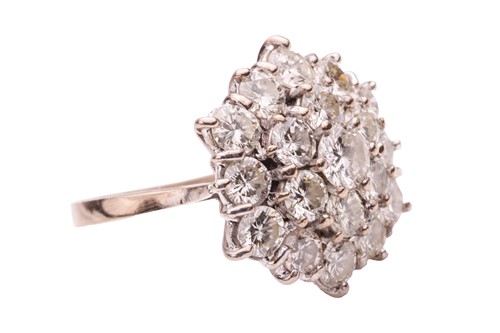 Lot 200 - A diamond-set floral cluster ring, featuring...