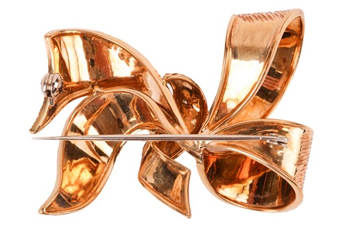 Lot 183 - A diamond-set bow brooch in 18ct gold, with...