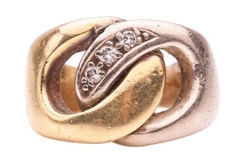 Lot 135 - A two-tone interlocking ring, highlighted with...