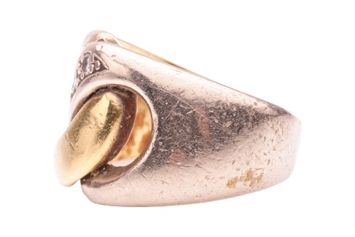 Lot 135 - A two-tone interlocking ring, highlighted with...