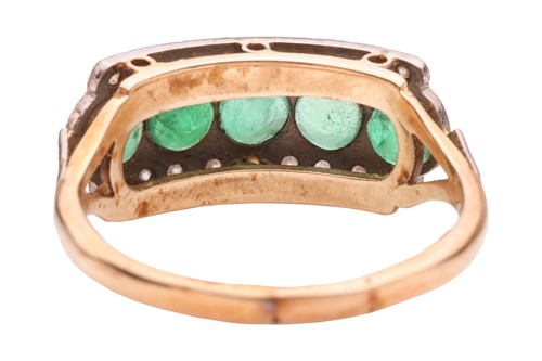 Lot 192 - An emerald and diamond-set dress ring, with...