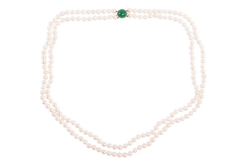 Lot 130 - A double-strand pearl necklace, the cultured...