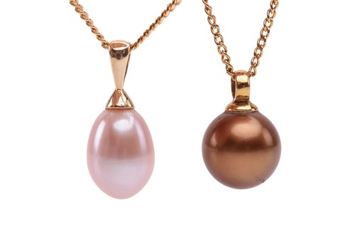 Lot 142 - Two cultured pearl pendants on chain; the...