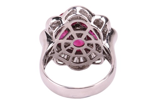Lot 158 - A ruby and diamond ballerina ring the central...