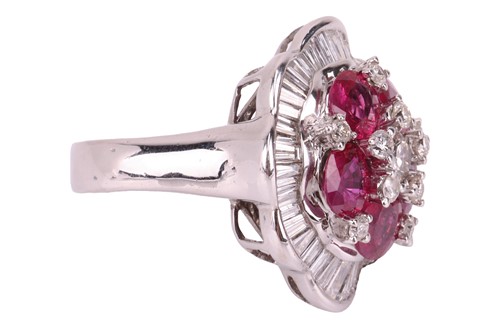 Lot 158 - A ruby and diamond ballerina ring the central...