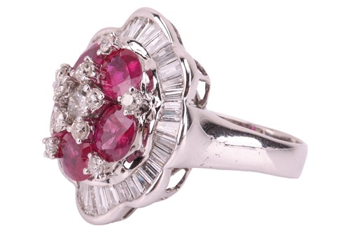 Lot 158 - A ruby and diamond ballerina ring the central...