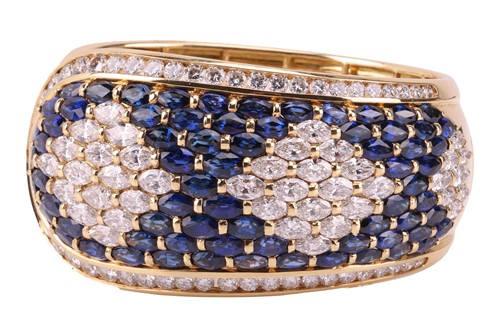 Lot 79 - A sapphire and diamond-hinged bangle the...