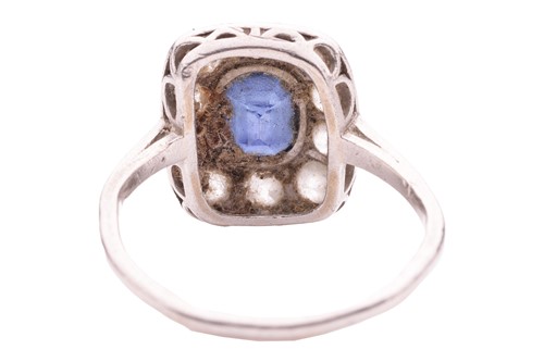 Lot 84 - A sapphire and diamond panel ring, the cushion-...