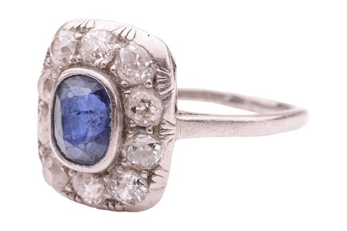 Lot 84 - A sapphire and diamond panel ring, the cushion-...