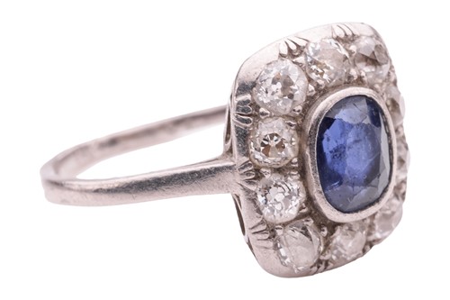 Lot 84 - A sapphire and diamond panel ring, the cushion-...