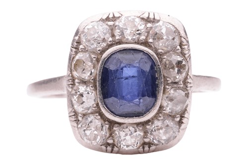 Lot 84 - A sapphire and diamond panel ring, the cushion-...