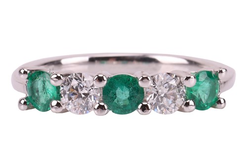 Lot 29 - An emerald and diamond-set half-hoop ring,...