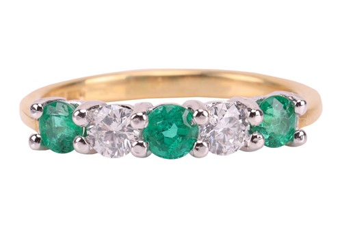 Lot 235 - An emerald and diamond-set half-hoop ring,...