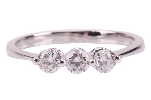 Lot 34 - A three-stone diamond-set ring, claw-set with...