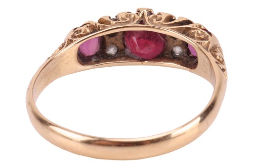 Lot 207 - An Edwardian ruby and diamond half-hoop ring...