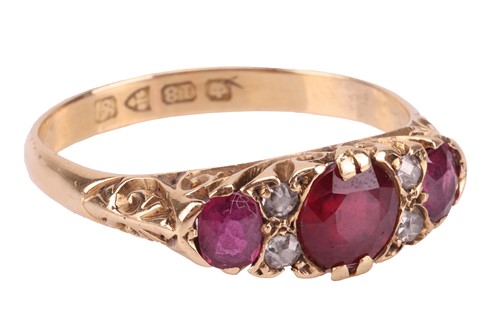 Lot 207 - An Edwardian ruby and diamond half-hoop ring...