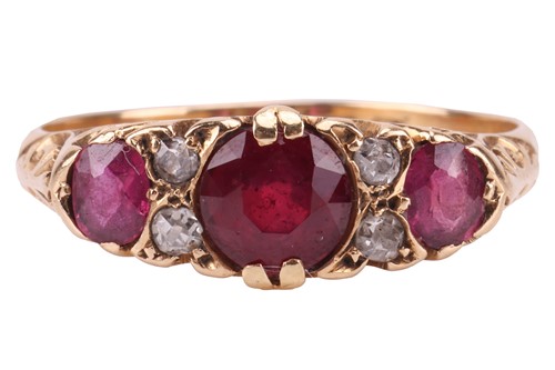 Lot 207 - An Edwardian ruby and diamond half-hoop ring...