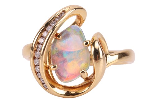 Lot 173 - An opal and diamond dress ring, featuring a...