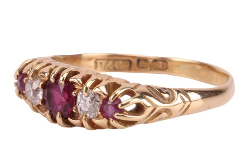 Lot 155 - An Edwardian ruby and diamond-set half-hoop...