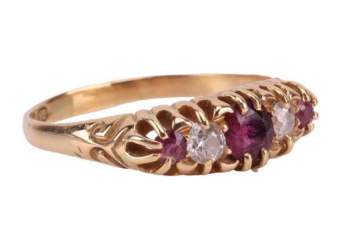 Lot 155 - An Edwardian ruby and diamond-set half-hoop...