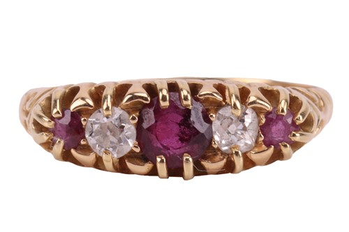 Lot 155 - An Edwardian ruby and diamond-set half-hoop...