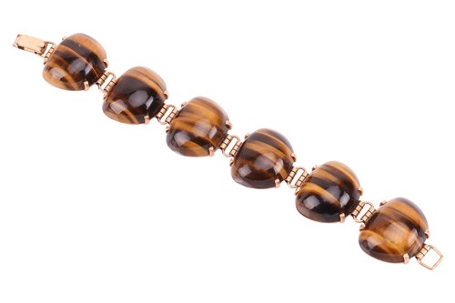 Lot 59 - A tiger's eye link bracelet, comprising six...